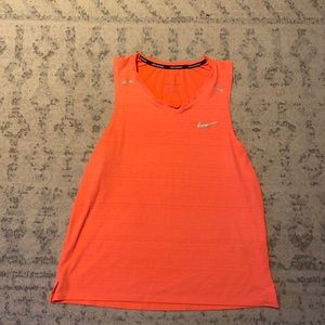 Medium Nike neon tank. Shorter torso